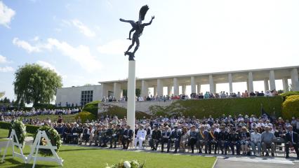 Members of the crowd sit during the ceremony. 