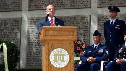 Ambassador Eisenberg delivers remarks from the podium. 