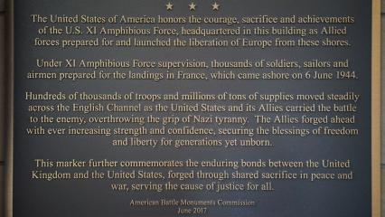 Text of this plaque commemorates the headquarters for the XI Amphibious Force.