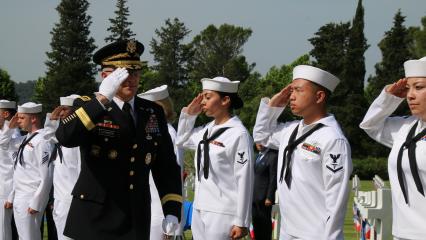 Sailors salute an Army officer during the ceremony. 