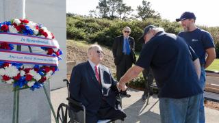 Secretary Max Cleland shakes hands with guests. 